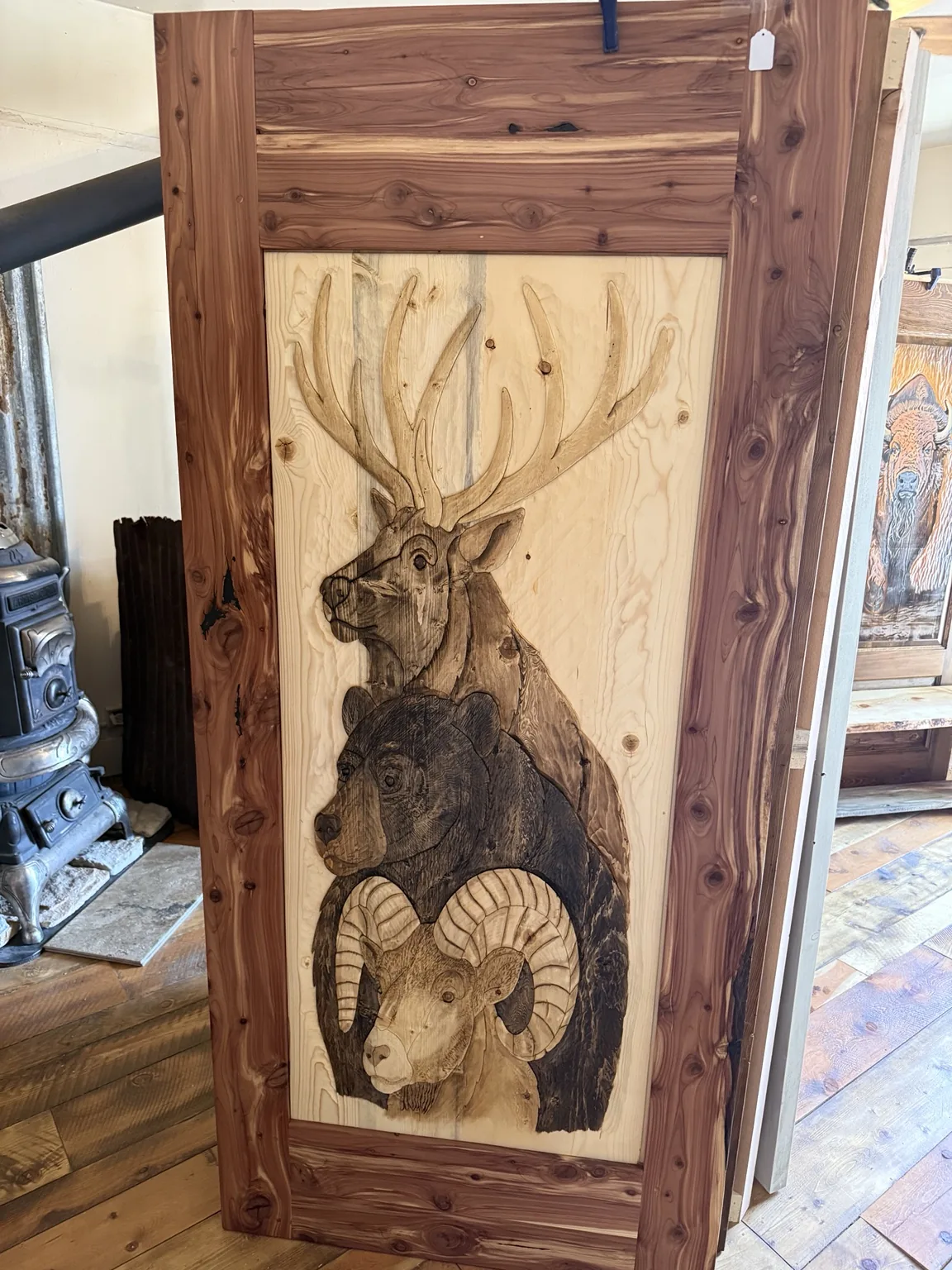 Wildlife door featuring elk, bear, and bighorn sheep